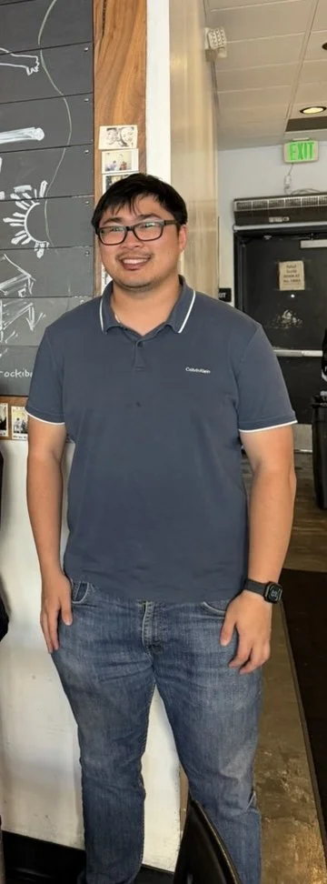 Caregiver or staff member smiling in facility common area