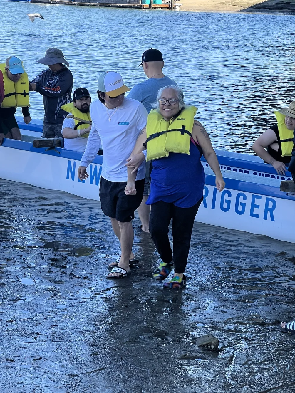 Residents and staff participating in assisted water recreation activity
